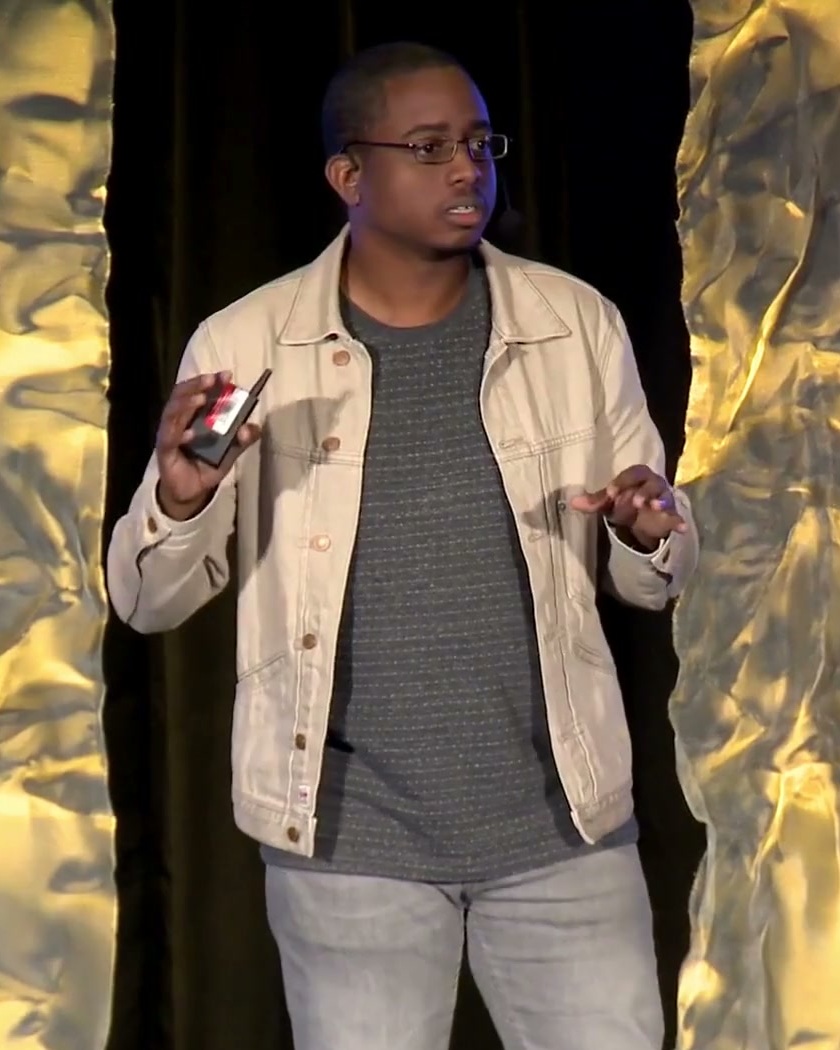 Kyle Graham speaking on stage